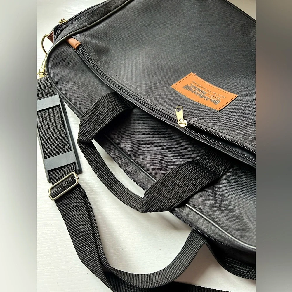 EUC black messenger tote adjustable shoulder strap handles gold hardware